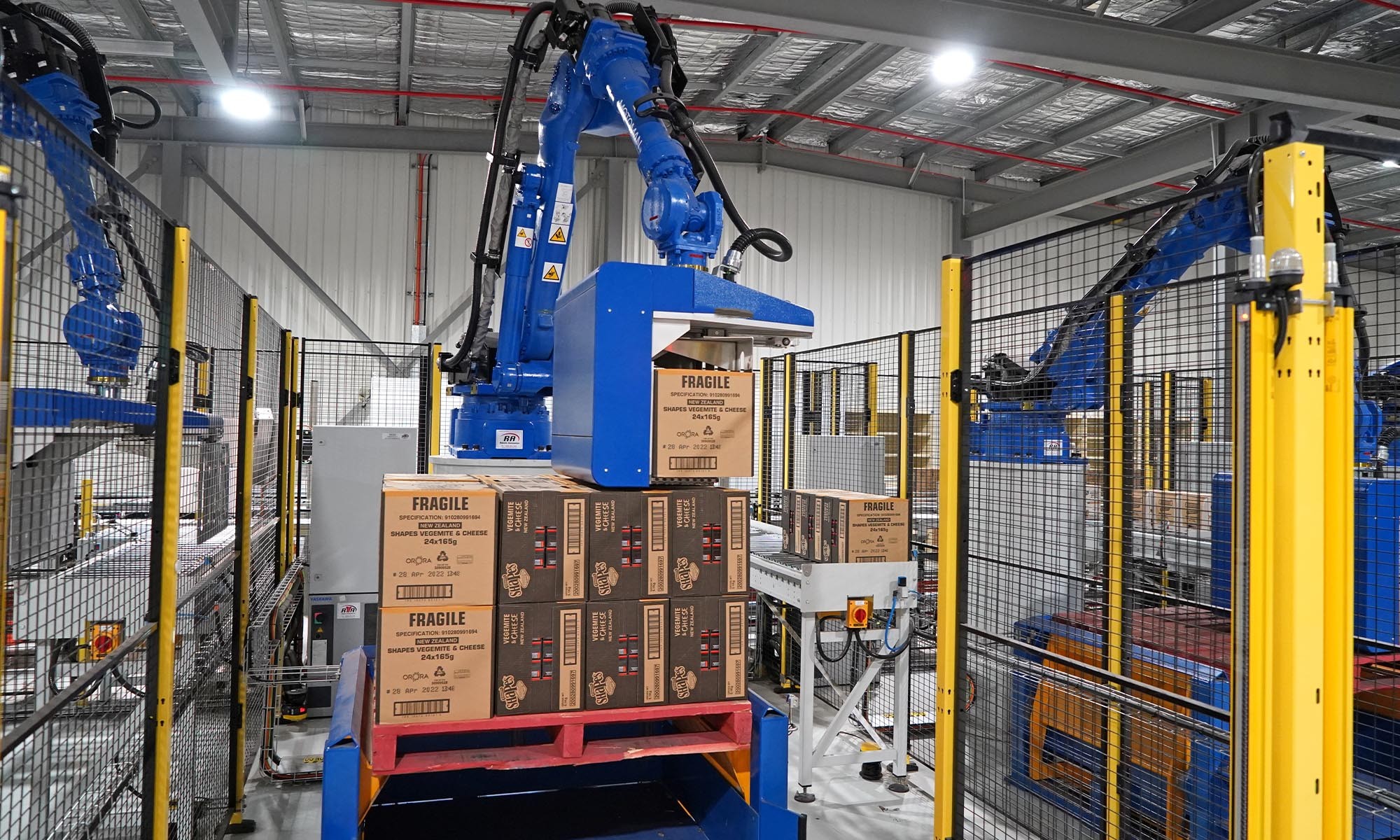 Robotic palletising cell handling cartons at a production line