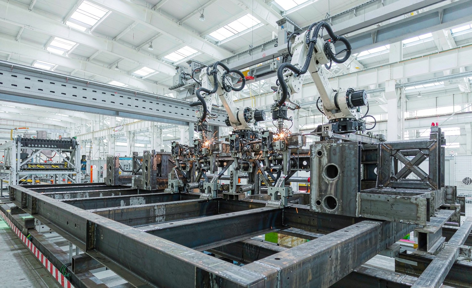 Dual gantry robotic welding system in a trailer manufacturing plant